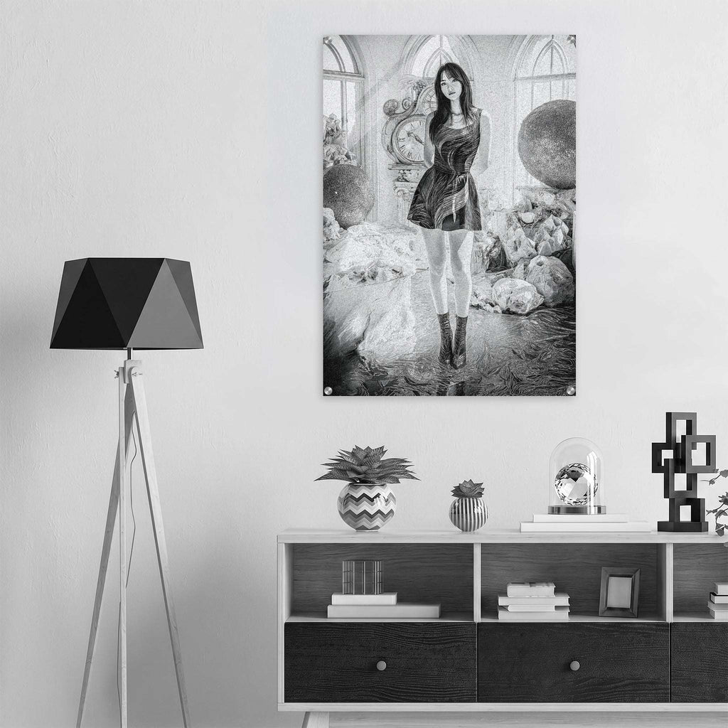 A black and white art print of a gothic fantasy scene featuring a woman in a dress, displayed on a light gray wall above a modern white and black sideboard with a black tripod floor lamp.
