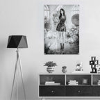 A black and white art print of a gothic fantasy scene featuring a woman in a dress, displayed on a light gray wall above a modern white and black sideboard with a black tripod floor lamp.