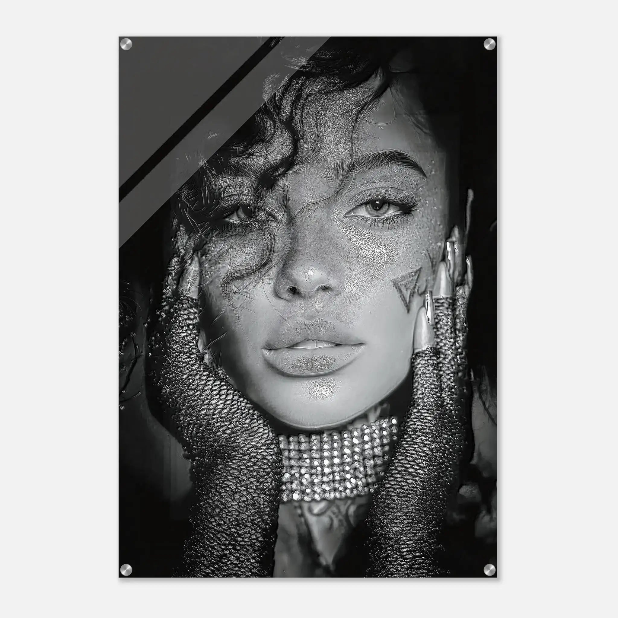 A black and white fashion portrait print of a woman with glitter, rhinestone gloves, and dramatic hair, shown as a poster or wall art with visible mounting holes.
