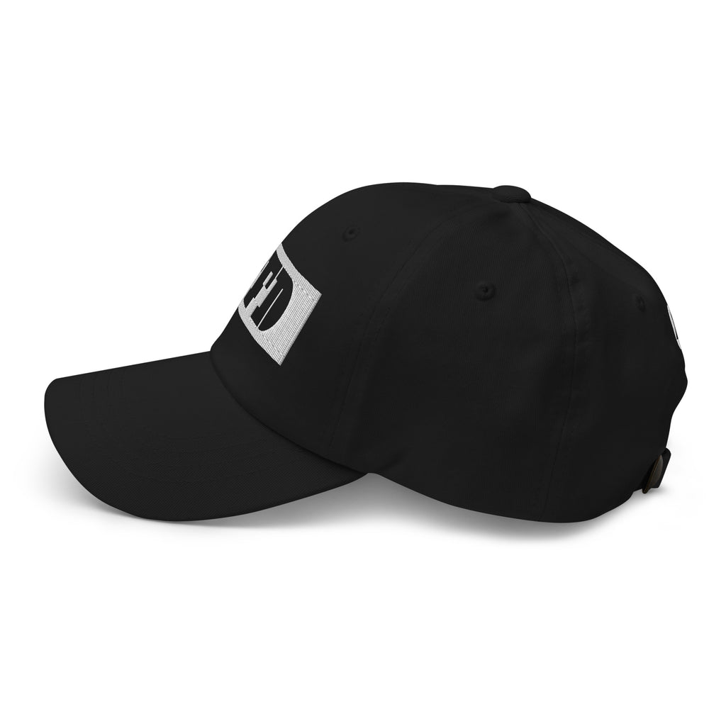 Black cap, left angle, curved visor and adjustable strap, wordmark edge at front from Form Finding Design