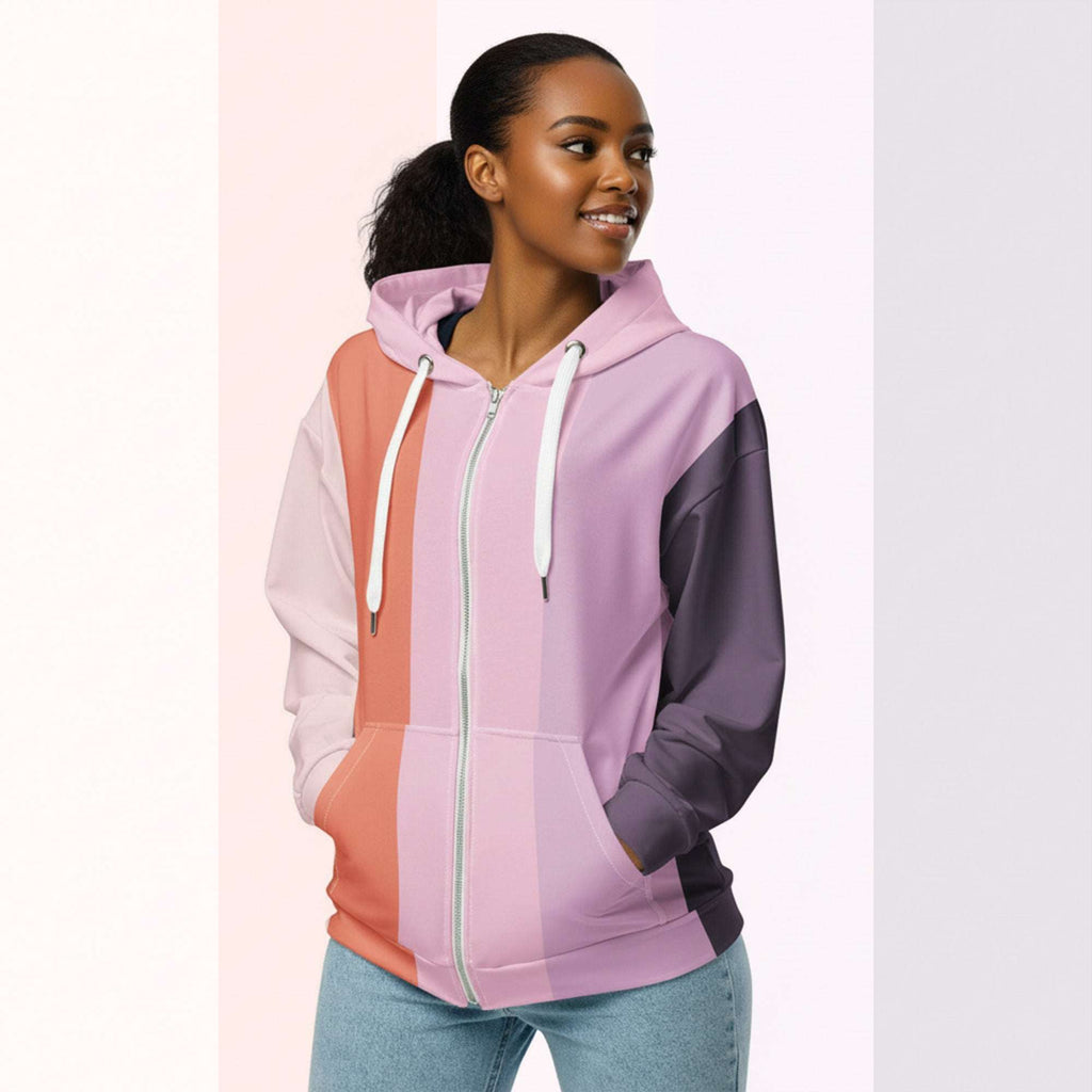Three‑quarter side view of the second woman wearing the Her Palette Strip Hoodie No. 14; pastel vertical stripes accent the body and sleeves, lavender hood and white drawstrings, pastel striped backdrop, pocket detail visible from Form Finding Design.