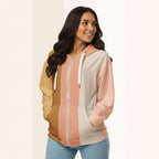 Three‑quarter side view of the second woman wearing the Her Palette Strip Hoodie No. 15; pastel vertical stripes accent the body and sleeves, lavender hood and white drawstrings, pastel striped backdrop, pocket detail visible from Form Finding Design.