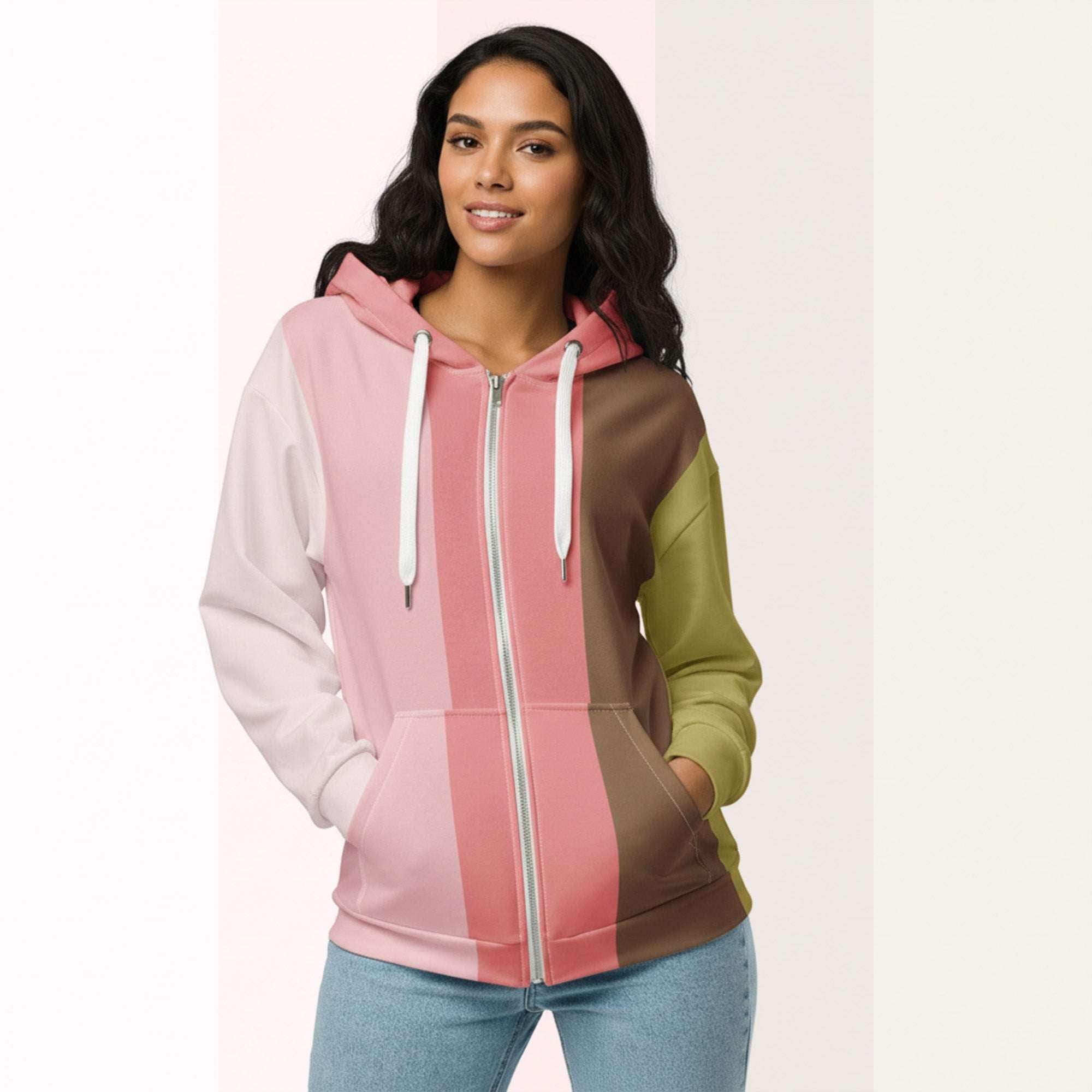 Front view of another woman wearing the Her Palette Strip Hoodie No. 17; pastel stripes cover the torso and sleeves, lavender hood lining and white zip, hands resting in the kangaroo pocket, pastel striped background from Form Finding Design.