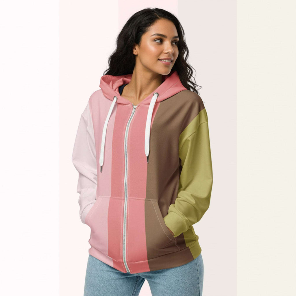 Three‑quarter side view of the second woman wearing the Her Palette Strip Hoodie No. 17; pastel vertical stripes accent the body and sleeves, lavender hood and white drawstrings, pastel striped backdrop, pocket detail visible from Form Finding Design.