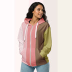 Three‑quarter side view of the second woman wearing the Her Palette Strip Hoodie No. 17; pastel vertical stripes accent the body and sleeves, lavender hood and white drawstrings, pastel striped backdrop, pocket detail visible from Form Finding Design.