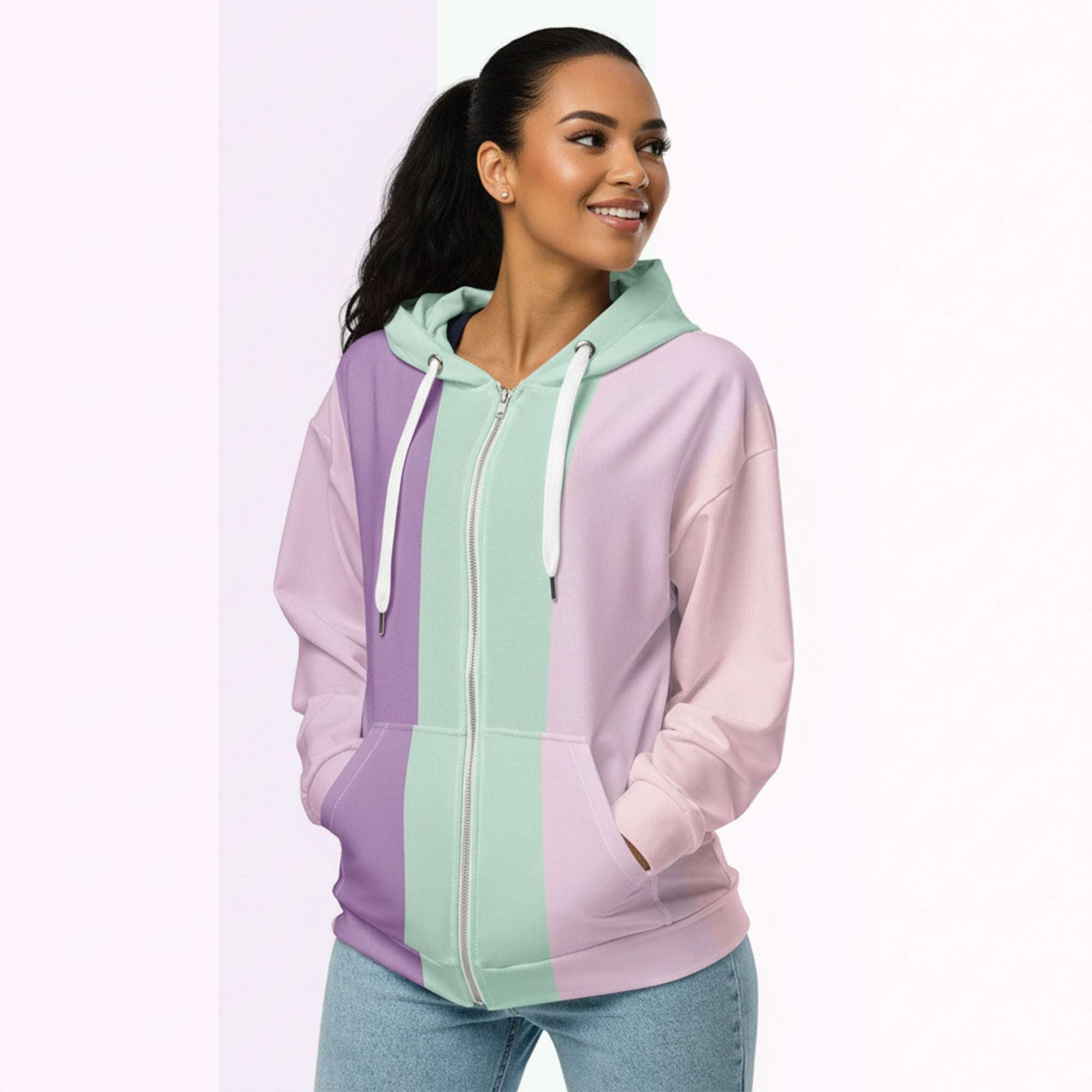 Three‑quarter side view of the second woman wearing the Her Palette Strip Hoodie No. 19; pastel vertical stripes accent the body and sleeves, lavender hood and white drawstrings, pastel striped backdrop, pocket detail visible from Form Finding Design.