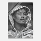 A black and white portrait print of a woman wearing a hooded sweatshirt, shown as a rectangular artwork with rounded corners on a light gray background.