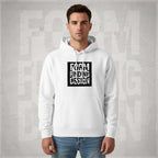 Front lifestyle portrait of male model wearing Form Finding Design Men’s Signature Hoodie, white—bold black square logo print, drawstring hood and pouch pocket, styled with blue jeans.