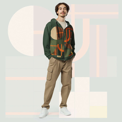 Male model wearing Form Finding Design Men’s Urban Utility Hoodie (No.11), front full-body—earth-tone geometric print zip hoodie with black drawstrings, styled with tan cargo trousers and white trainers, minimal architectural studio backdrop.