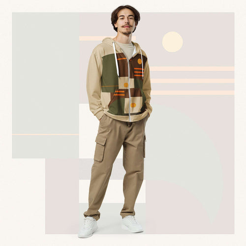 Male model wearing Form Finding Design Men’s Urban Utility Hoodie (No.15), front full-body—earth-tone geometric print zip hoodie with black drawstrings, styled with tan cargo trousers and white trainers, minimal architectural studio backdrop.