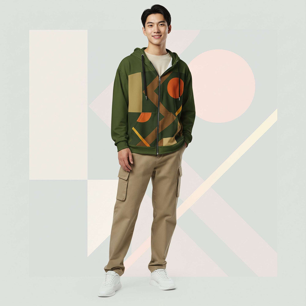 Lifestyle image of male model in Form Finding Design Men’s Urban Utility Hoodie (No.19), three-quarter stance—designer earth-palette geometric print highlighted across chest and sleeves, zip-front hoodie, neutral modern studio backdrop.