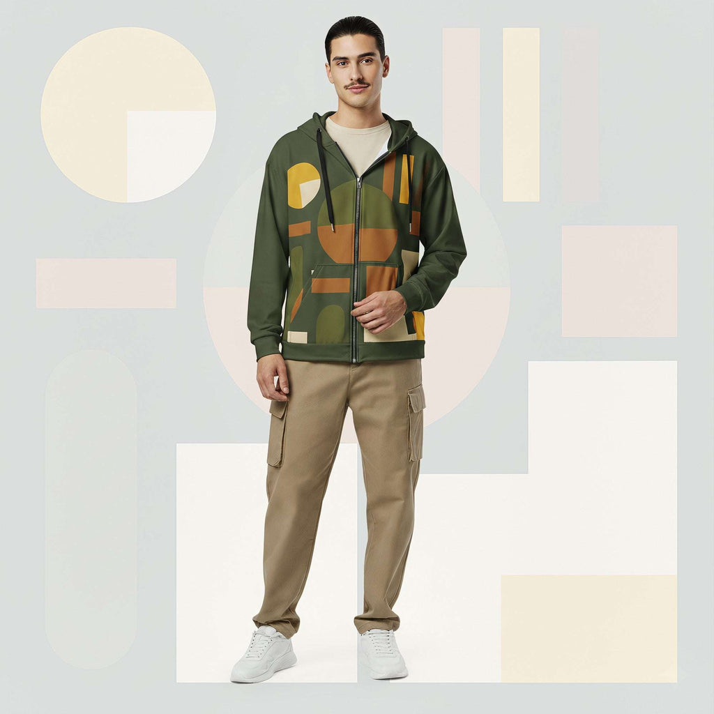 Lifestyle image of male model in Form Finding Design Men’s Urban Utility Hoodie (No.20), three-quarter stance—designer earth-palette geometric print highlighted across chest and sleeves, zip-front hoodie, neutral modern studio backdrop.