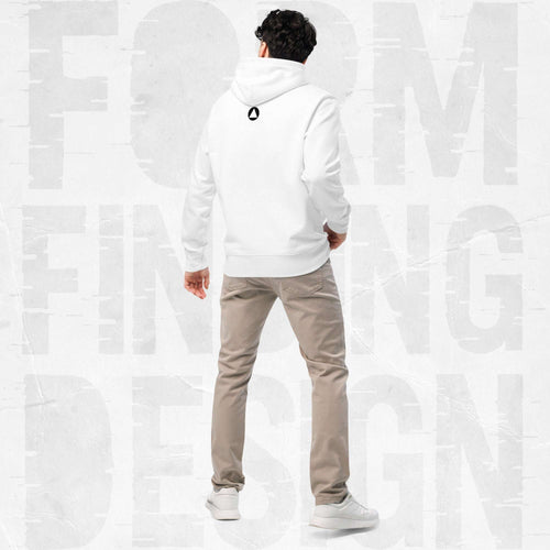 Back view on model in Form Finding Design Men’s Signature Hoodie (FFD-07), white—minimal back with small black circular emblem below the hood, paired with beige chinos and white trainers.