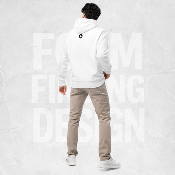Back view on model in Form Finding Design Men’s Signature Hoodie (FFD-13), white—minimal back with small black circular emblem below the hood, paired with beige chinos and white trainers.