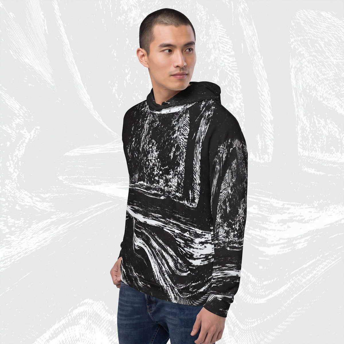 Man in a black stipple print hoodie no.04, three-quarter view, halftone image running across chest and sleeve.