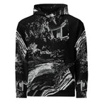 A black pullover hoodie featuring a high-contrast black and white abstract landscape print with stylized trees, water, and architectural elements, shown against a plain white background.