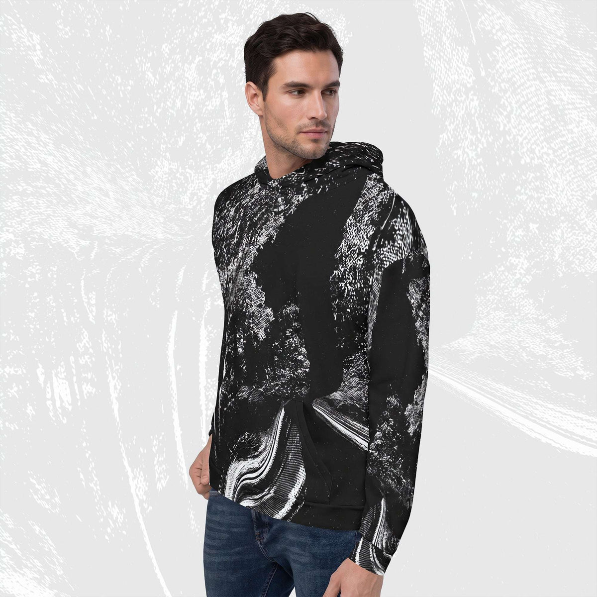 Man in a black stipple print hoodie no.06, three-quarter view, halftone image running across chest and sleeve.