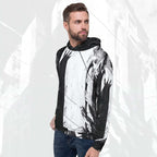 A man wearing a black and white abstract print hoodie with blue jeans, standing against a light gray background with a faint cityscape pattern.