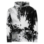 A pullover hoodie featuring a high-contrast black and white abstract paint splatter and brushstroke pattern, shown against a plain white background.