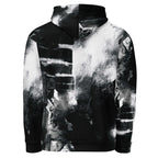 A black and white hoodie featuring an abstract, high-contrast splattered and smoky graphic print, shown against a plain white background.
