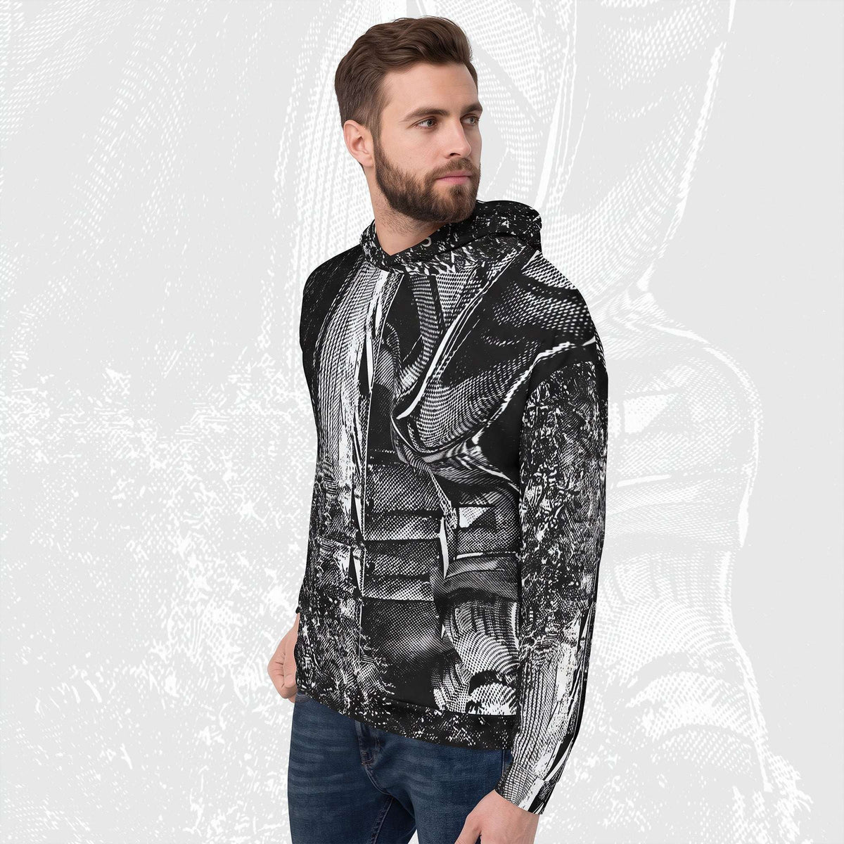 Man in a black stipple print hoodie, three-quarter view, halftone image running across chest and sleeve.