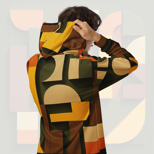Form Finding Design Men’s Urban Utility Hoodie (No.04) —hoodie’s all-over earth-tone geometric print flowing across back and hood, paired with tan cargo trousers and white trainers, clean studio setting.