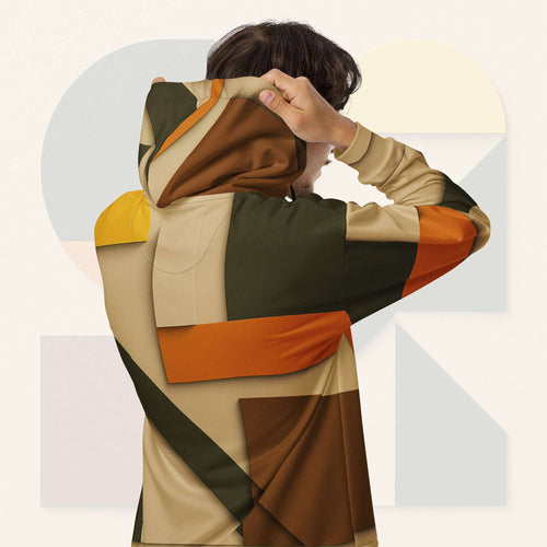 Form Finding Design Men’s Urban Utility Hoodie (No.07) —hoodie’s all-over earth-tone geometric print flowing across back and hood, paired with tan cargo trousers and white trainers, clean studio setting.
