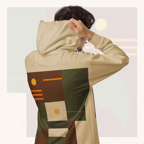 Form Finding Design Men’s Urban Utility Hoodie (No.15) —hoodie’s all-over earth-tone geometric print flowing across back and hood, paired with tan cargo trousers and white trainers, clean studio setting.