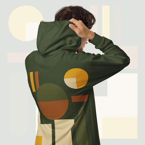 Form Finding Design Men’s Urban Utility Hoodie (No.20) —hoodie’s all-over earth-tone geometric print flowing across back and hood, paired with tan cargo trousers and white trainers, clean studio setting.