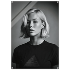 A black and white portrait poster of a woman with short blonde hair wearing a dark t-shirt, displayed as a wall art print with visible mounting holes in the corners.