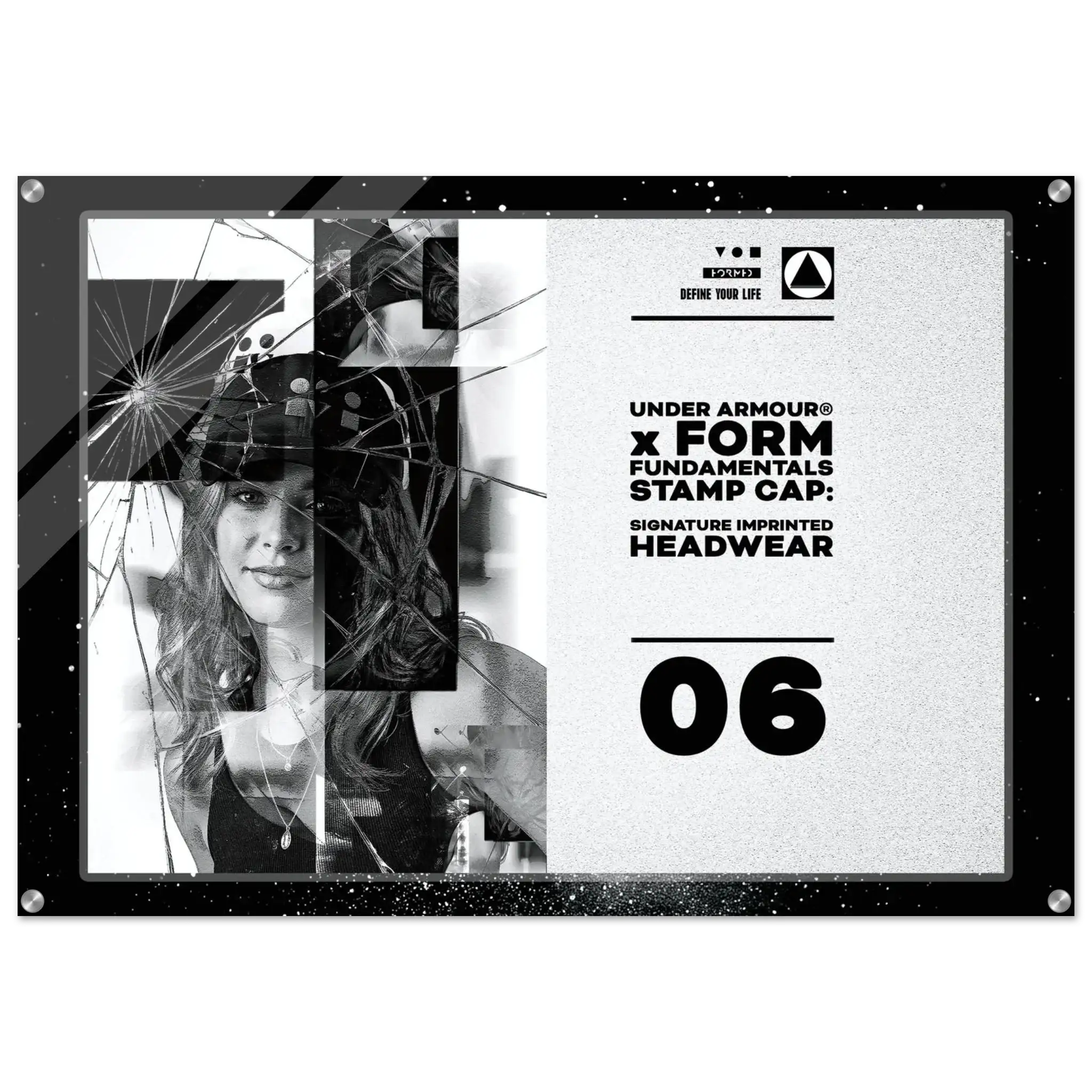 A square black acrylic stamp cap featuring a split design: one side shows a black-and-white photo of a woman broken by a spiderweb graphic overlay, and the other side displays text including 'UNDER ARMOUR x FORM FUNDAMENTALS STAMP CAP', 'SIGNATURE IMPRINTED HEADWEAR', and '06'.