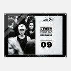 A rectangular acrylic wall art print with rounded corners and visible mounting holes, shown against a light gray background. The print features a black-and-white photo of a woman in a cap on the left and black text on a light textured right side reading 'UNDER ARMOUR x FORM FUNDAMENTALS STAMP CAP SIGNATURE IMPRINTED HEADWEAR' with '09' below.