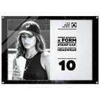 A rectangular promotional print or poster with a black border, featuring a black-and-white photo of a woman wearing an Under Armour cap and holding a drink, alongside printed text on a light background. The visible text includes 'UNDER ARMOUR x FORM FUNDAMENTALS STAMP CAP: SIGNATURE IMPRINTED HEADWEAR' and the number '10'.