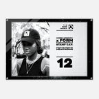 A black and white Under Armour x Form Fundamentals stamp cap design poster or print, featuring a black-and-white portrait of a woman wearing a cap on the left and product text including 'UNDER ARMOUR x FORM FUNDAMENTALS STAMP CAP' and 'SIGNATURE IMPRINTED HEADWEAR' on the right, all enclosed in a black frame with visible corner hardware.