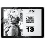 A rectangular framed print or poster with a black border, featuring a black-and-white photo of a woman wearing a cap on the left and printed text on the right that reads 'UNDER ARMOUR x FORM FUNDAMENTALS STAMP CAP: SIGNATURE IMPRINTED HEADWEAR' and the number '13'.