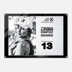 A rectangular Under Armour stamp cap headwear graphic print with a black border, featuring a black-and-white photo of a woman in a cap on the left and product text on the right, including 'UNDER ARMOUR x FORM FUNDAMENTALS STAMP CAP' and 'SIGNATURE IMPRINTED HEADWEAR' with the number 13.