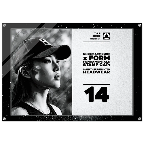 A rectangular acrylic or glass stamp cap plaque featuring a black-and-white portrait of a woman wearing a cap on the left, with product text on the right including 'UNDER ARMOUR x FORM FUNDAMENTALS STAMP CAP' and the number 14.