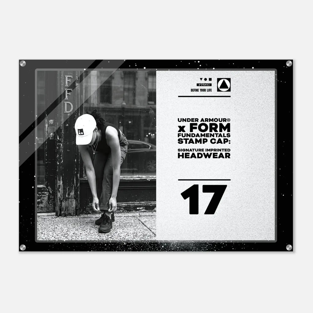 A rectangular Under Armour x Form Fundamentals Stamp Cap graphic print or poster, featuring a black-and-white photo of a person tying shoes on the left and bold text on the right, including 'UNDER ARMOUR x FORM FUNDAMENTALS STAMP CAP' and the number '17'.