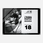 A rectangular black-and-white promotional print or poster featuring a woman in a baseball cap on the left and text on the right including 'UNDER ARMOUR x FORM FUNDAMENTALS STAMP CAP' and the number 18. The print is shown against a light gray background with a subtle drop shadow.