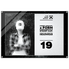 A rectangular acrylic wall art print featuring a black-and-white photo of a person wearing a white Under Armour cap, alongside product text that reads 'UNDER ARMOUR x FORM FUNDAMENTALS STAMP CAP: SIGNATURE IMPRINTED HEADWEAR' and the number '19'.