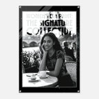 Poster with a woman sitting at an outdoor cafe table, featuring text about 'The Signature Collective'.
