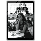 Woman sitting at a table with a cup of coffee and a dessert, with 'The Signature Collective' branding.