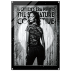 Woman wearing a patterned shirt with text in front of a textured background