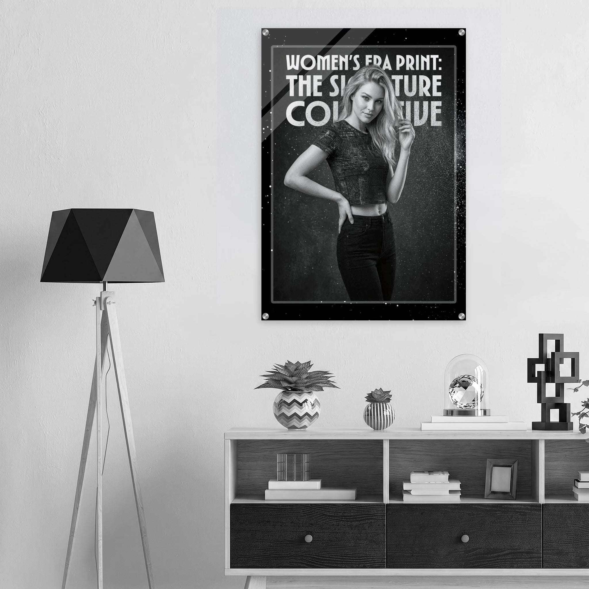 Poster of a woman with text on a wall above a shelf with decor items.