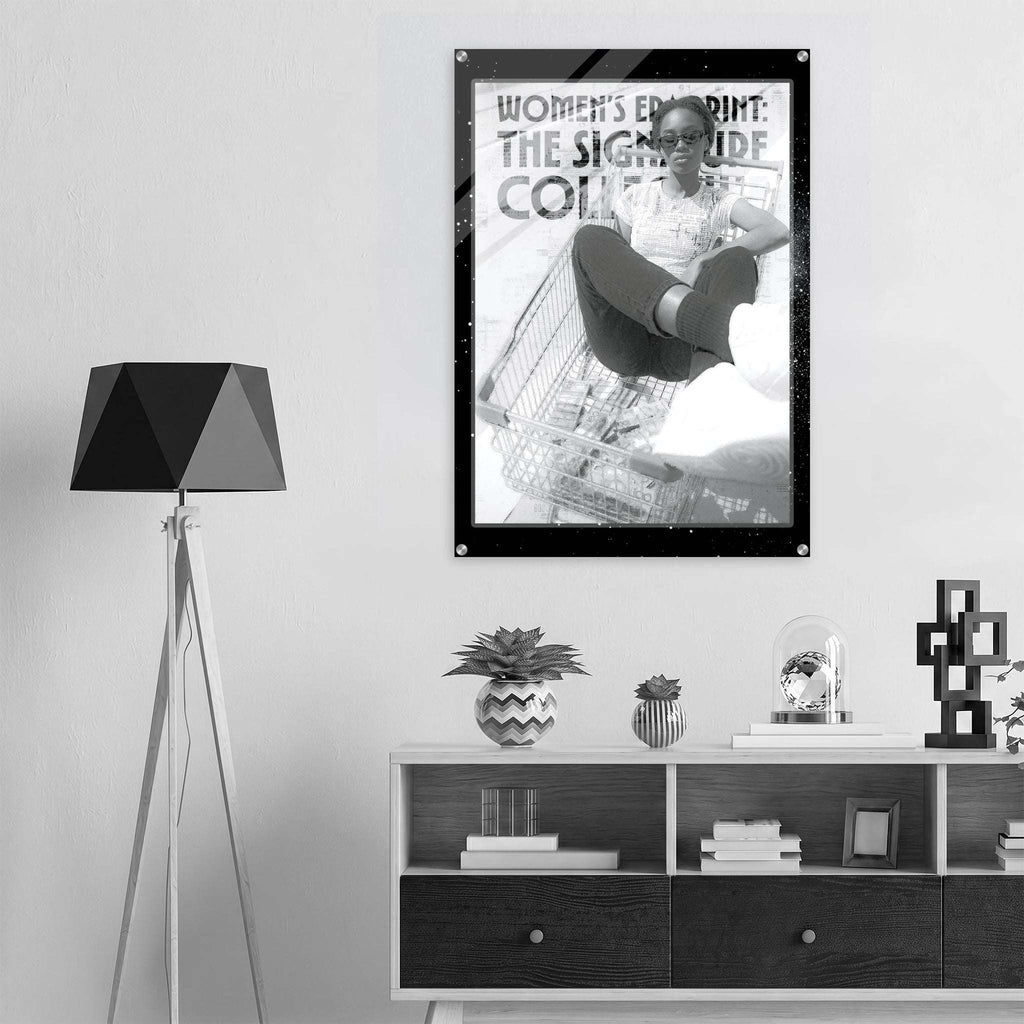 Poster of a woman in a shopping cart on a wall above a shelf with decor items.