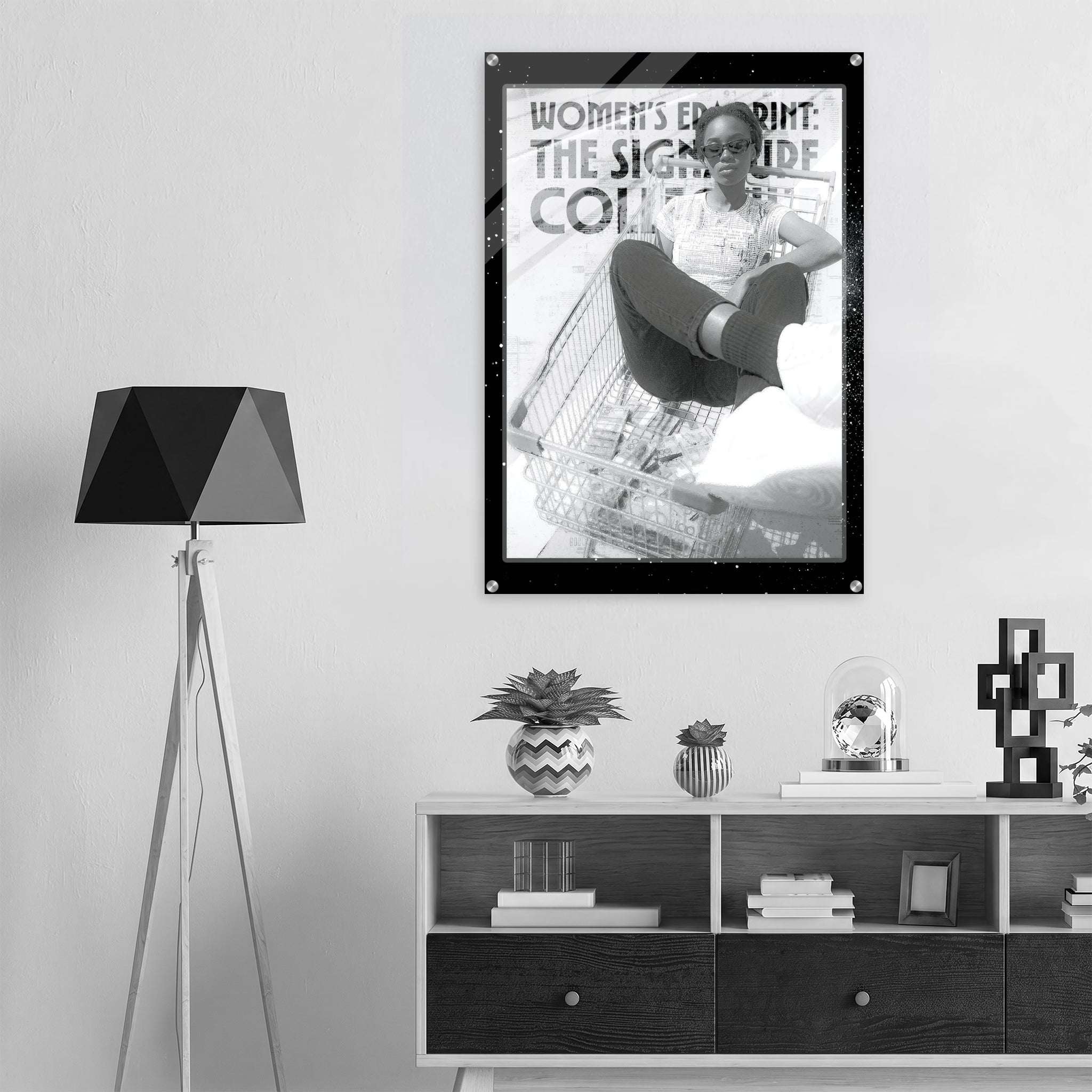 Poster of a woman in a shopping cart on a wall above a shelf with decor items.