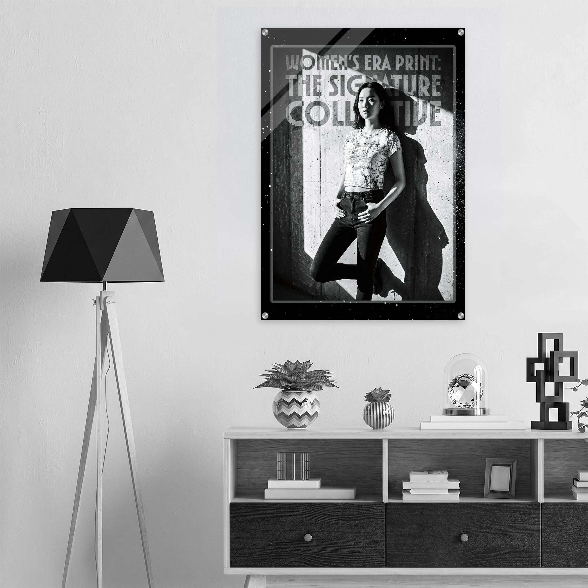 Poster of a woman in a superhero costume on a wall above a shelf with decor items.