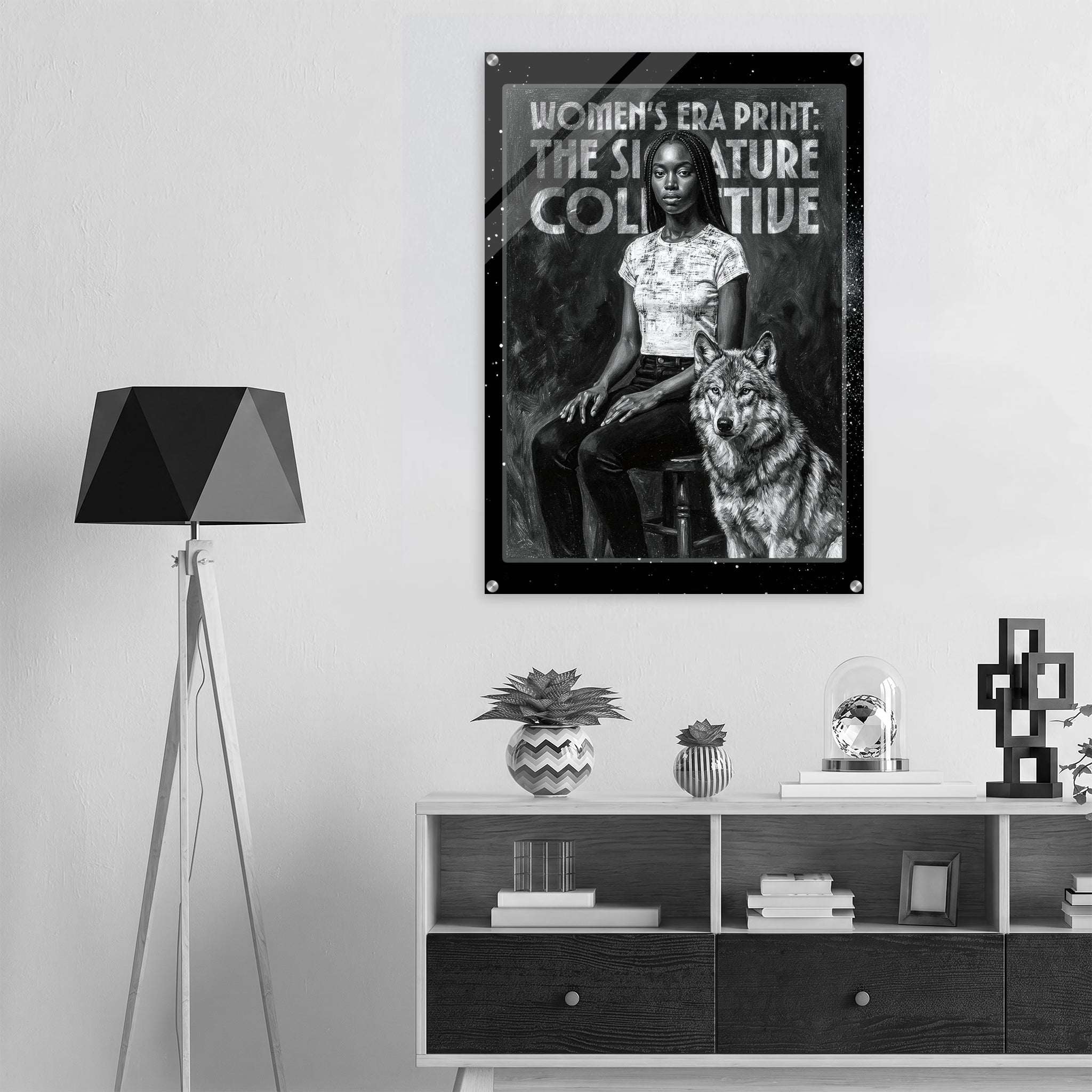 Poster of a woman and wolf with text on a wall above a shelf with decor items.