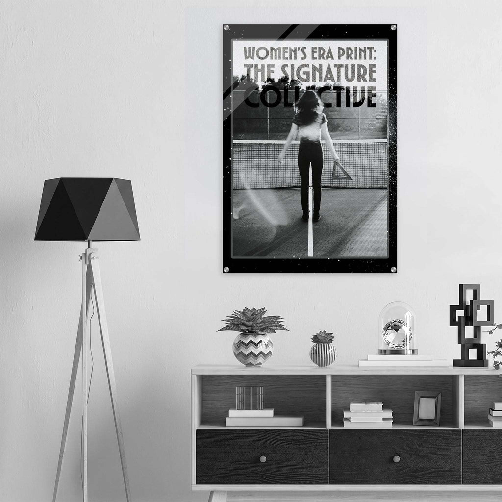 Poster of a woman on a tennis court with 'Women's Era Print' text, displayed in a room with decor elements.