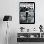 Poster of a woman on a tennis court with 'Women's Era Print' text, displayed in a room with decor elements.